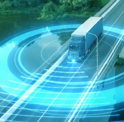 Connected automotive lorry travelling down a motorway with sensor lines emintating from it