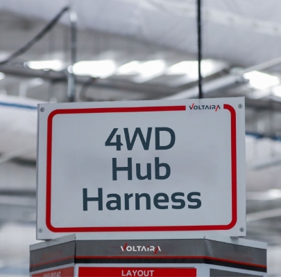 Sign saying '4WD Hub Harness' in a Voltaira factory