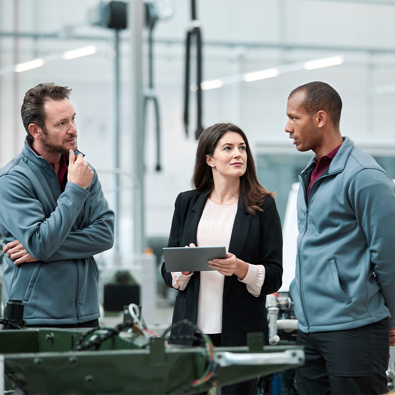 Workers in an EV parts factory