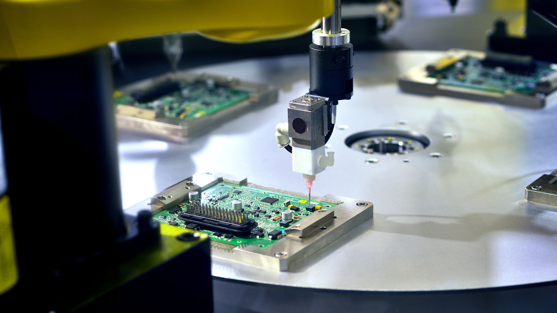 Robot arm soldering a chip