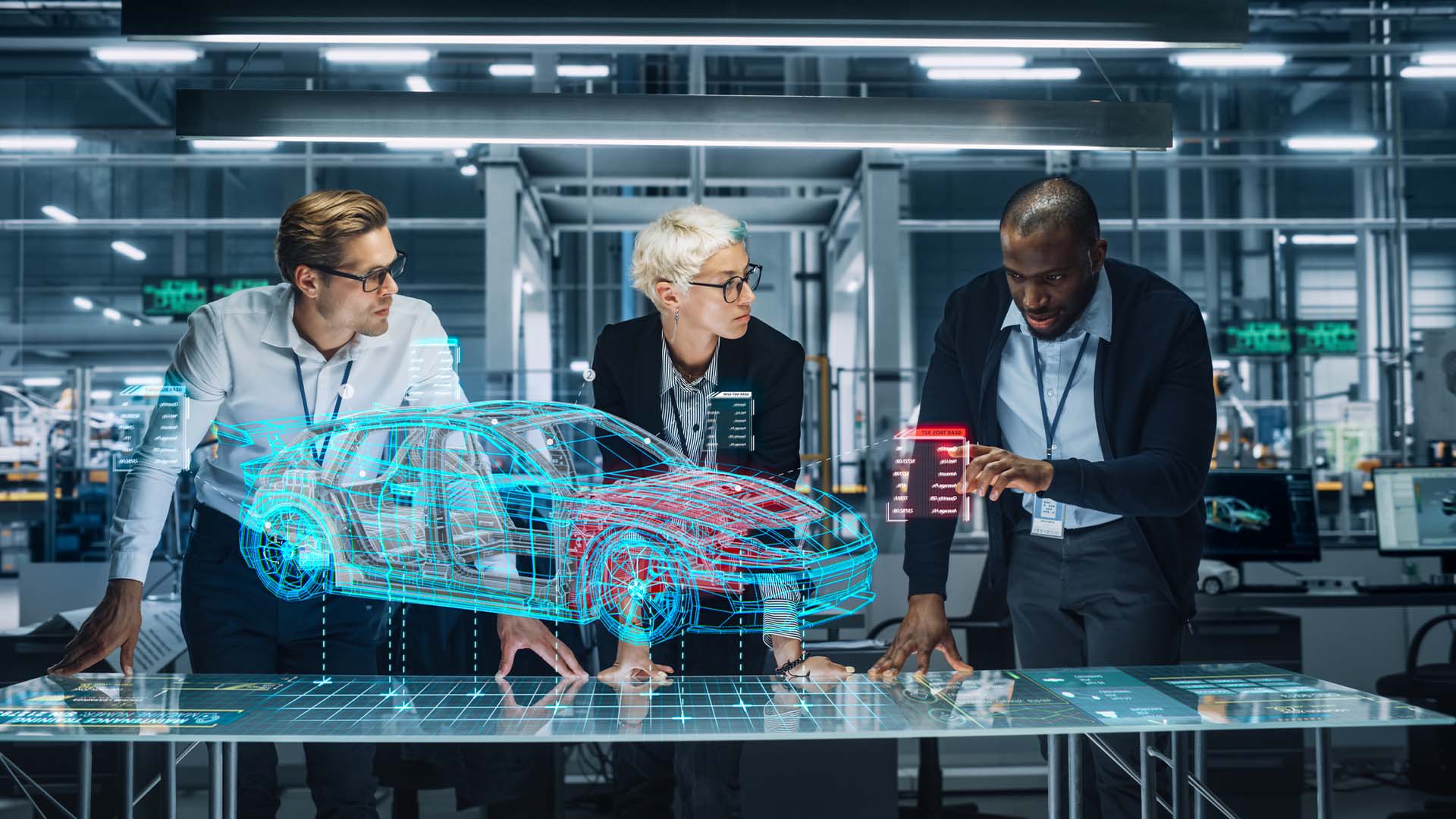 Individuals working over a hologram of a car