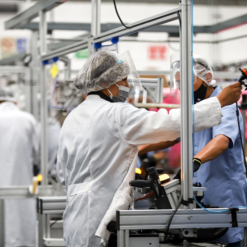 Workers in an automotive plants manufacturing plant